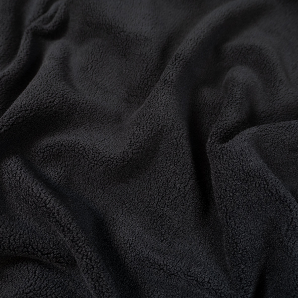 ikat-e-tissus-micro-polaire-noir-extensible image 1
